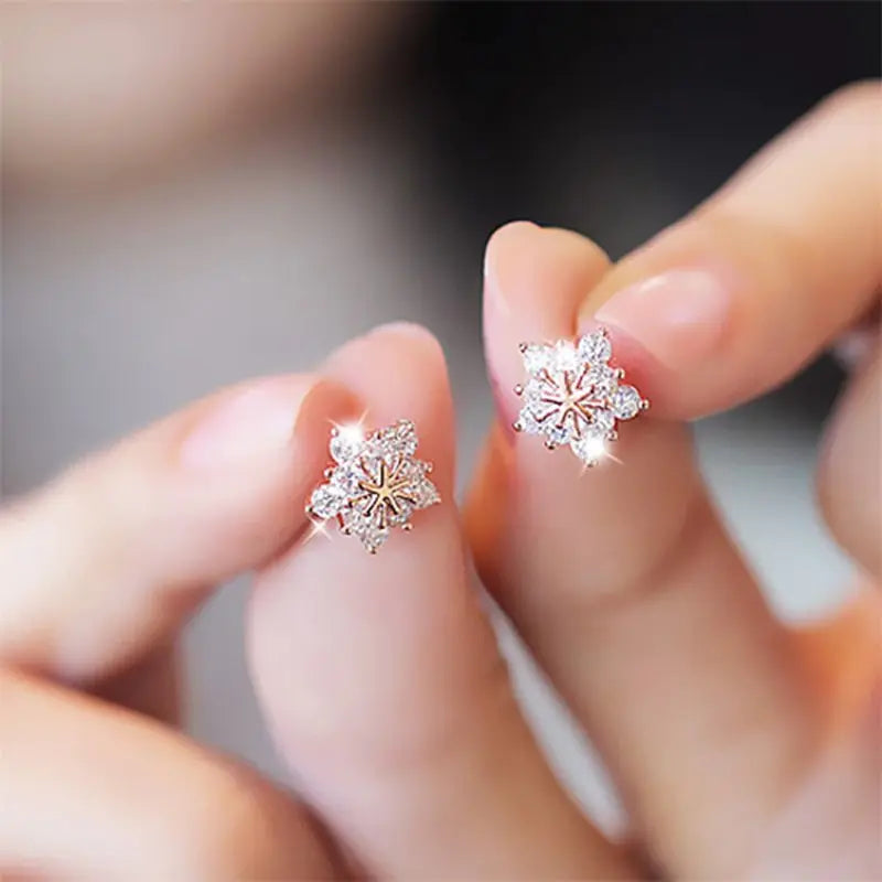 Close-up of Zircon Christmas Snowflake Stud Earrings with radiant crystals, featuring a delicate snowflake design, perfect for holiday celebrations